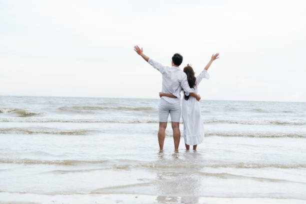 istock Couple going honeymoon on tropical beach in summer 1049595748