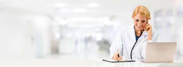 istock Doctor using laptop computer at the hospital. 1049599460