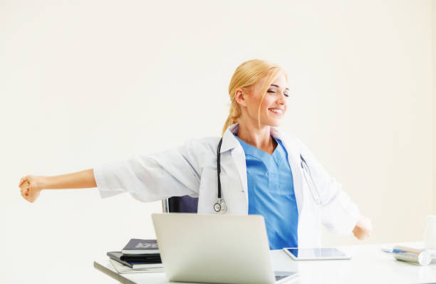 istock Relaxed doctor taking a break in hospital office. 1049599694
