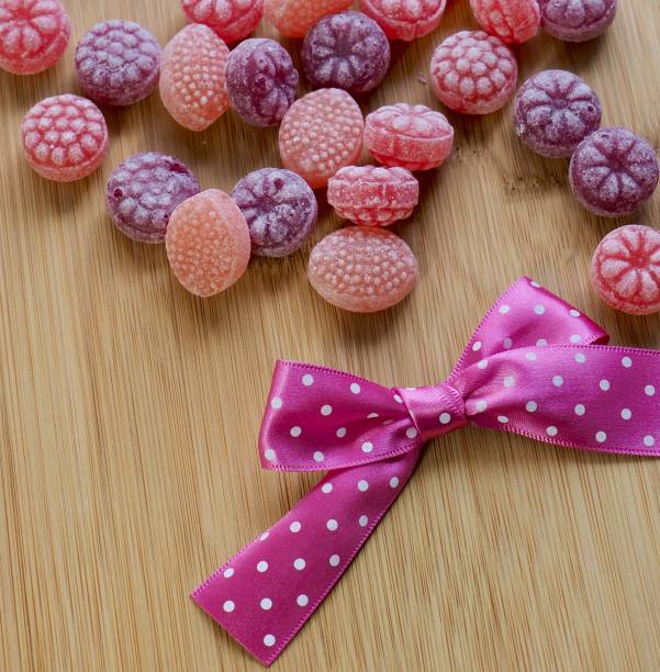 istock Pink ribbon and candy 1049604970