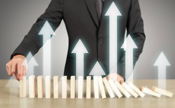 istock Stopping domino concept 1049612692