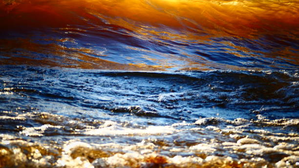 istock Close-up wave in the glow of the sunset 1049612944