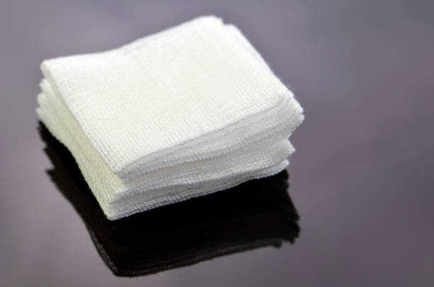 stack of sterile gauze pad on dark background. - gauze imagens e fotografias de stock