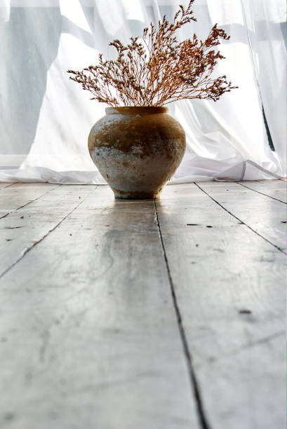 istock Ceramic vase with dry flowers. 1049621238