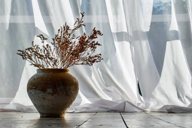 Ceramic vase with dry flowers.
