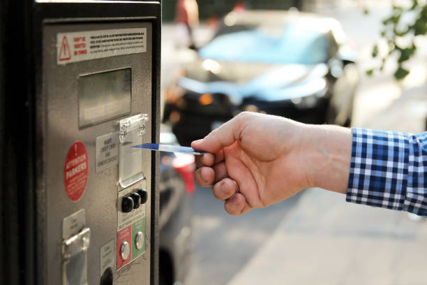 istock man is paying his parking using credit card at parking pay station terminal 1049622776