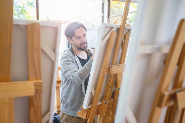 Man painting in an art class