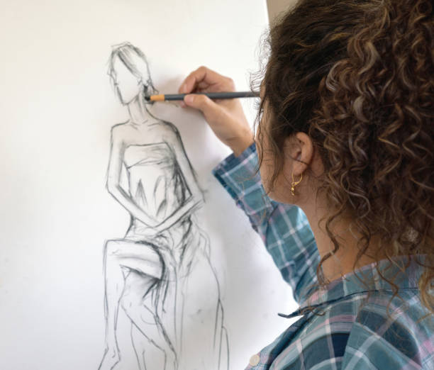istock Woman painting in an art class 1049623926