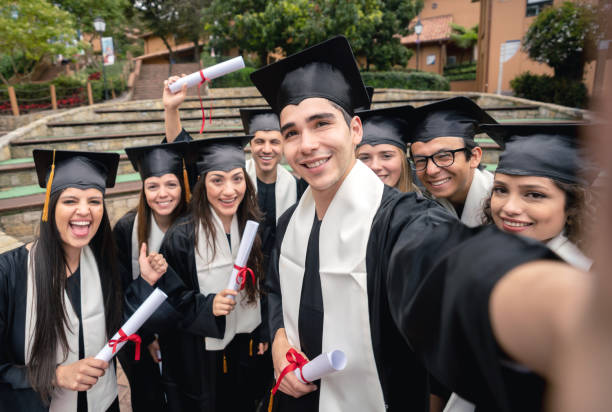 istock Group of graduate students taking a selfie on graduation day 1049624008
