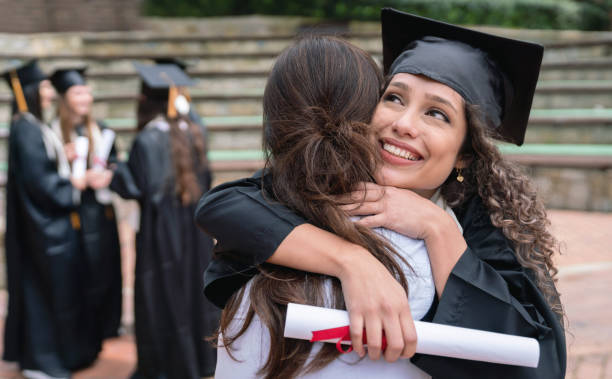 istock Happy student hugging her mother and celebrating her graduation 1049624064