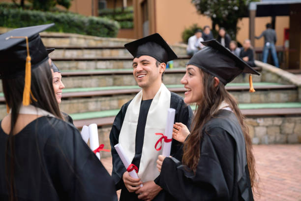 istock Happy group of graduate students talking 1049624068