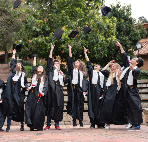 istock Excited group of students celebrating their graduation 1049624138