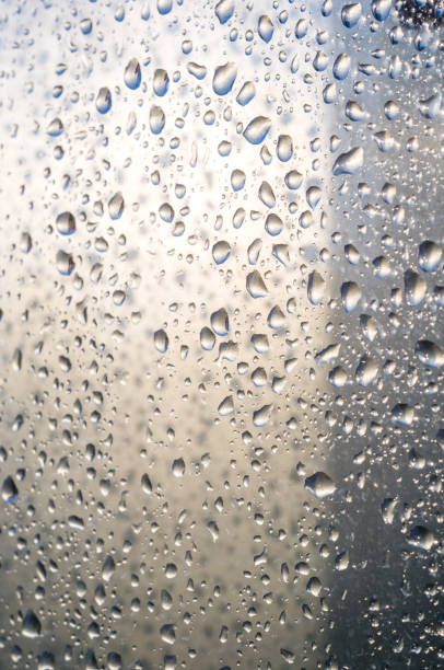 istock background of raindrops on window glass, close up 1049632358