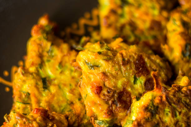 istock Fried vegetable fritters with zucchini, carrots, herbs, eggs, and cheese. 1049634460