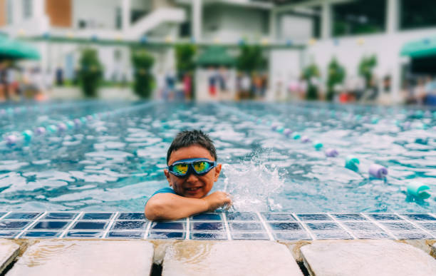 istock boy smiling at swimming pool 1049637436