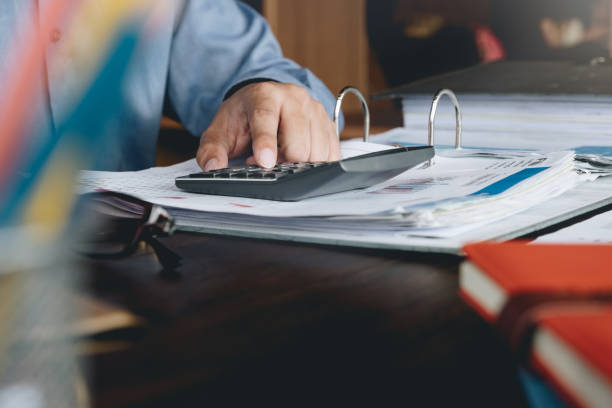 istock Businessman working with financial documents and calculator in office. Business analysis and strategy concept. 1049637992