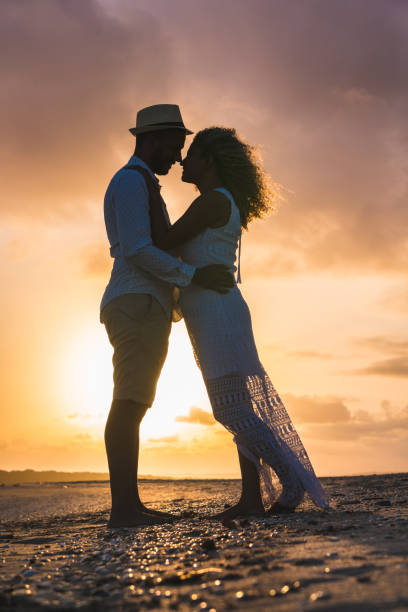 istock Silhouette of couple at sunset 1049649550