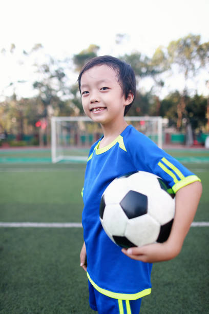 istock Boy with soccer ball 1049655722