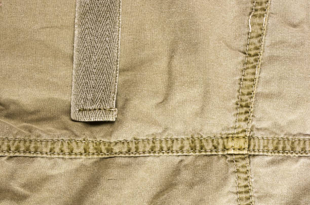 istock clothing items washed cotton fabric texture with seams 1049655774