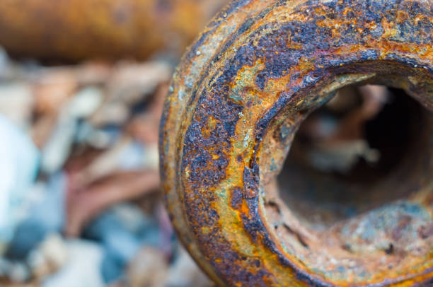 istock Very rusty metal on a gray cracked rock 1049658828