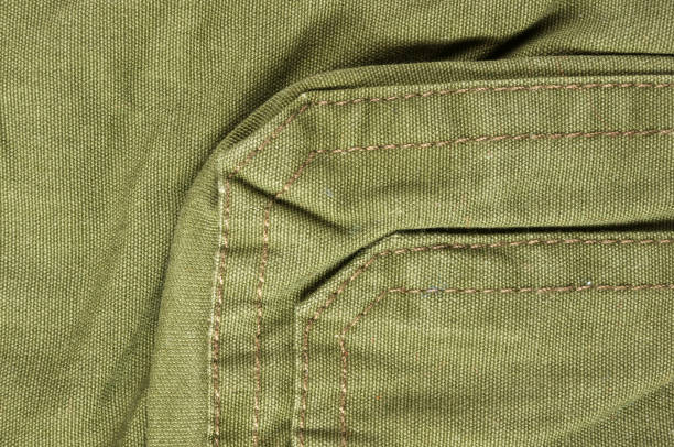 istock clothing items washed cotton fabric texture with seams 1049658924