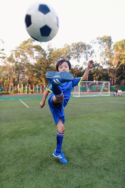 istock Boy with soccer ball 1049659040