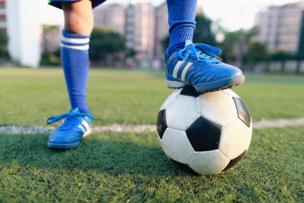 istock Boy with soccer ball 1049659328