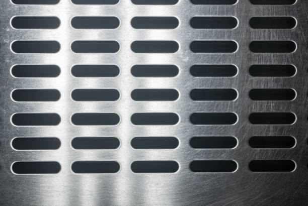 istock stainless steel grating with oblong holes, close up 1049659912
