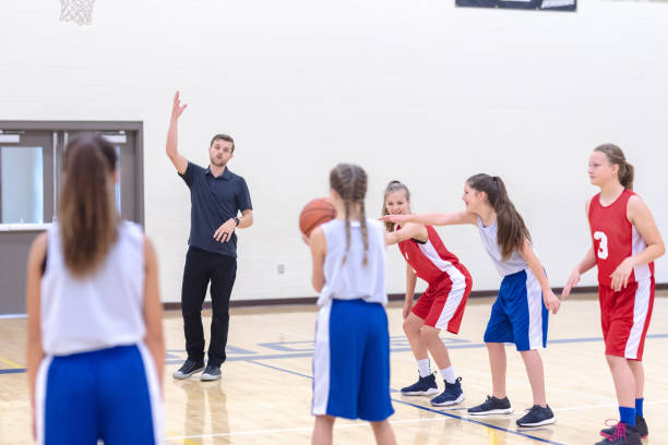 istock Girls basketball team practicing 1049661464