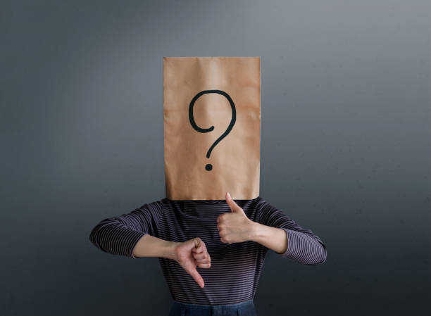 istock Customer Experience Concept. Client Woman with Question Mark Icon on Paper Bag has Confused to Feedback Review Between Positive and Negative 1049661688