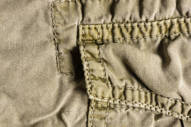 istock clothing items washed cotton fabric texture with seams 1049661982