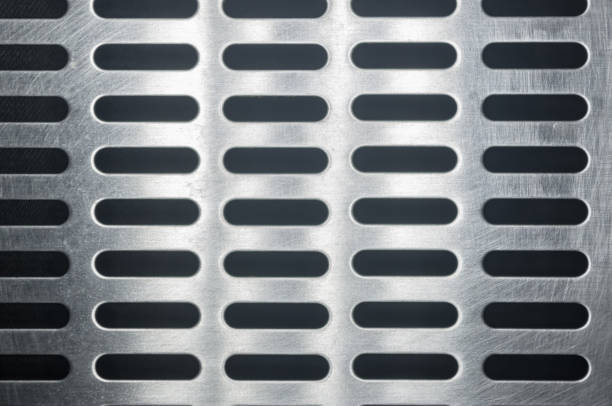 istock stainless steel grating with oblong holes, close up 1049662252