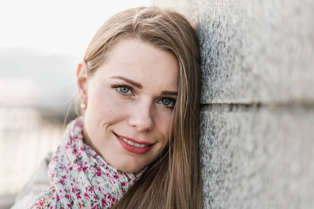 istock Smiling young woman outdoors 1049664664