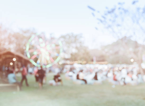 istock Absrtact blurred background of people at county fair 1049664678