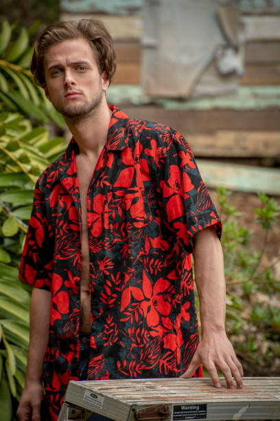 istock young man in red shirt at his alternative house. 1049670488