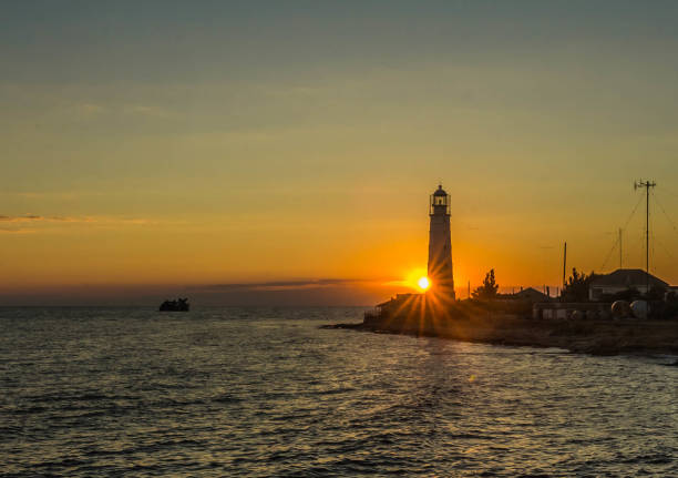 istock Lighthouse at sunset in Olenivka, Crimea, Russia 1049673062