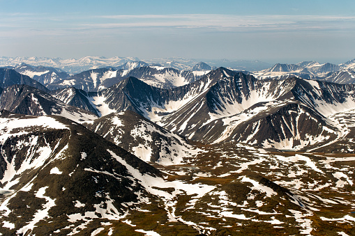 Northern landscape. The mountains are covered with glaciers. View from helicopter flight altitude