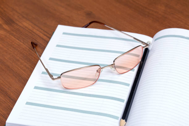 istock Glasses and pen on the diary 1049674084