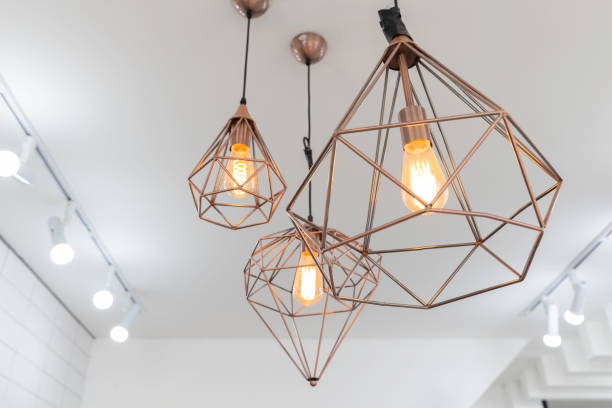 istock retro interior copper hanging lamp with orange light bulb. 1049679564