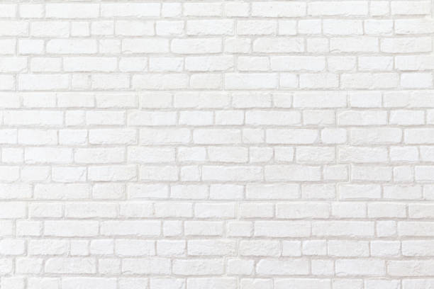 weathered white brick wall texture background. stock photo