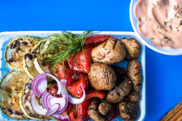 istock Vegetables baked on fire. Marrow, mushrooms, red pepper. 1049679960