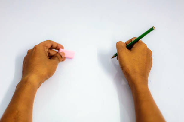 istock Hand writing virtual thing, isolated on white background. Close up Hand and arm pencil and eraser. Can use for Show your product presentation. Female hand explaining pointing writing doing something 1049682328