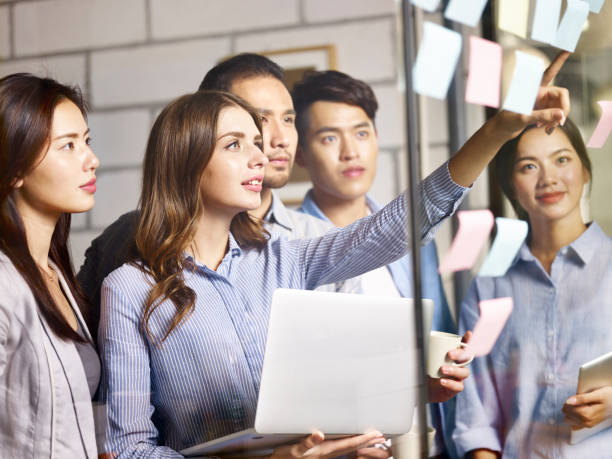 istock young asian corporate executive working together in office 1049682704