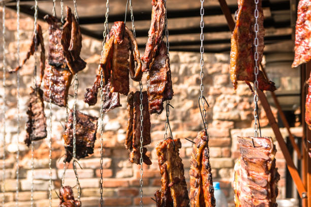 istock Smoked meat hung on a chain. Grill, barbecue. 1049682758