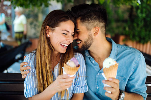 istock Happy couple having date and eating ice cream 1049688504