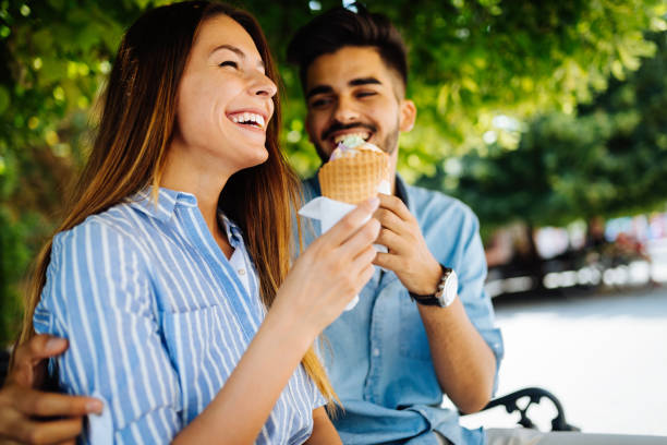 istock Happy couple having date and eating ice cream 1049688512