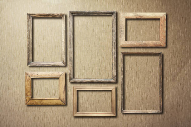 istock old photo frames on retro wallpaper 1049688612