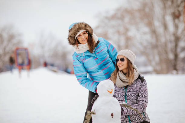 istock Two friends make the snowman 1049691162