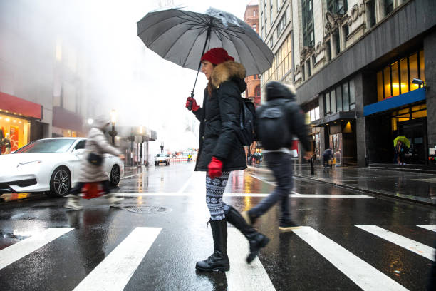 Winter walks in New York City - Woman crossing the street.