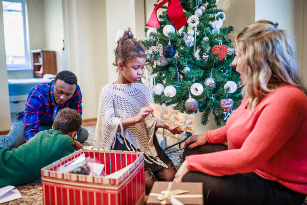 istock Mixed race family  decorating home for Christmas 1049694120